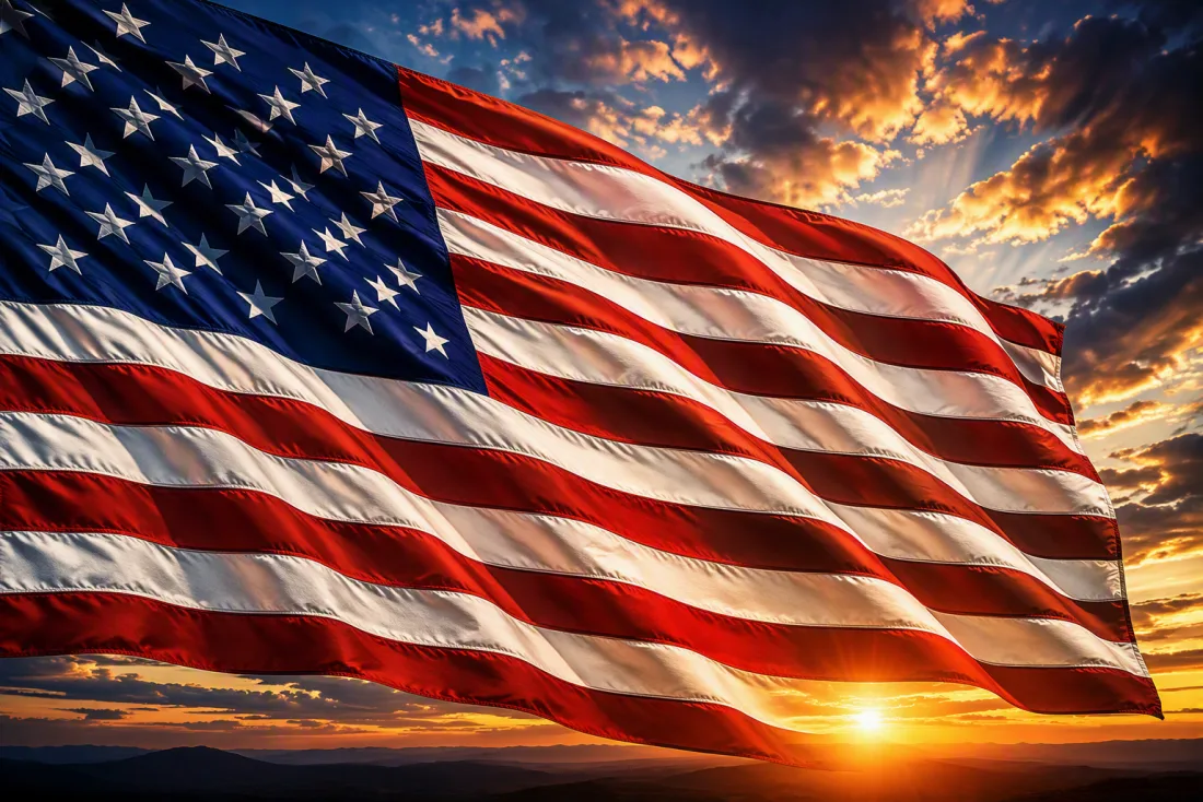 The American flag waving at sunset